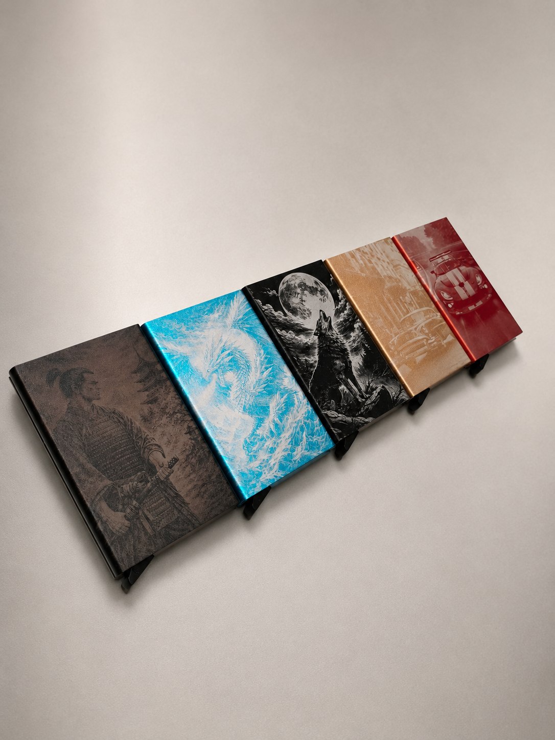 Five engraved RFID wallets: samurai, ice dragon, wolf, vintage car and racecar designs